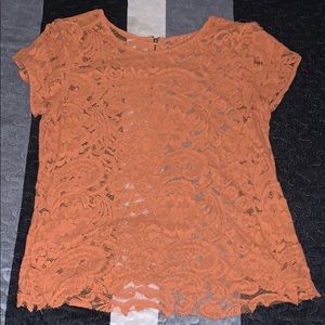 A see through brownish shirt